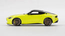 a yellow toy car with black wheels