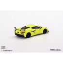 a yellow toy car on a white background