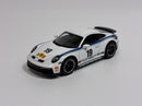 a white toy car with blue stripes