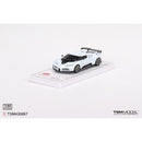 a white toy car on a white surface