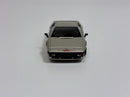 a toy car on a white surface