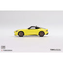 a yellow toy car on a white background