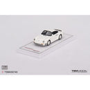 a white toy car on a white surface
