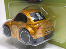 a gold toy car in a package