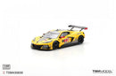 a yellow race car on a white background