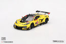 a yellow race car with black and red numbers