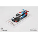 a toy car on a white surface