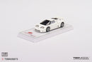 a white toy car on a white surface