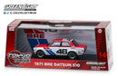 a red and white toy car in a box