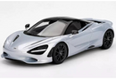a silver sports car with black roof