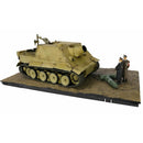 a model of a tank with a couple of men standing next to it