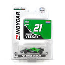 a green toy car in a package