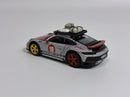 a toy car with luggage on top