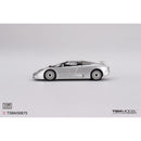 a silver toy car on a white background