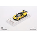 a yellow race car on a white stand