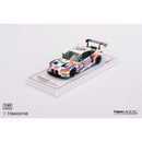 a toy race car on a white surface