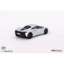 a white toy car on a white background