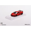a red toy car on a white surface