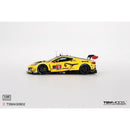a yellow race car with black and red stickers