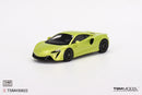 a green toy car on a white background