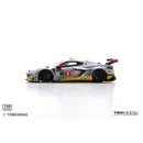 a silver race car with yellow and blue stripes