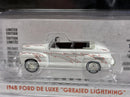 a white toy car in a plastic package