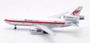 a white airplane with red stripes