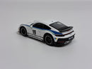 a white toy car with blue and black stripes