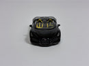 a black toy car with yellow seats