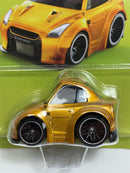 a yellow toy car in a package