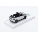 a toy car on a white surface