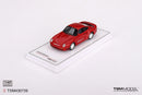 a red toy car on a white surface