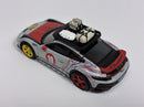 a toy car with luggage on top