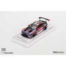 a toy car on a white surface