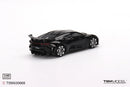 a black toy car on a white background