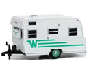 a white toy camper trailer