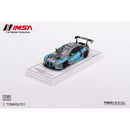 a toy car on a white surface