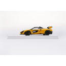 a yellow toy car on a white surface