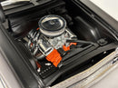 a model car engine with a hood open