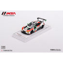 a toy car on a white surface