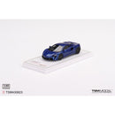 a blue toy car on a white surface