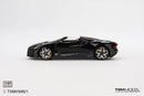 a black toy car on a white background