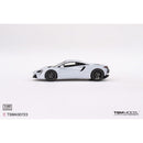 a white toy car on a white background