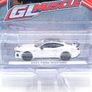 a white toy car in a package