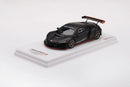 a black sports car on a white surface
