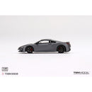 a grey sports car on a white background