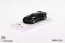 a black toy car on a white surface