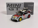 a toy car next to a box