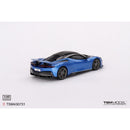 a blue sports car on a white background
