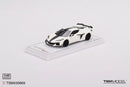 a white toy car on a white surface